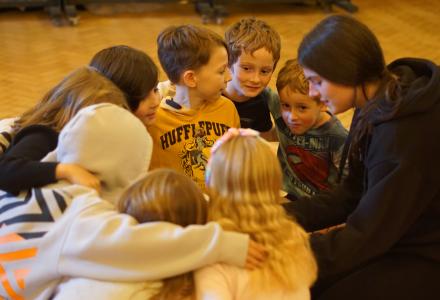 A group of young people huddled together.