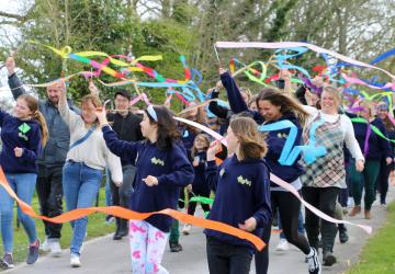 A group of people with streamers 