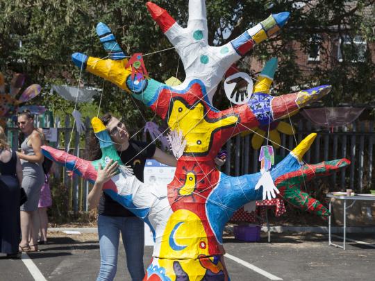 Colourfully painted tree sculpture